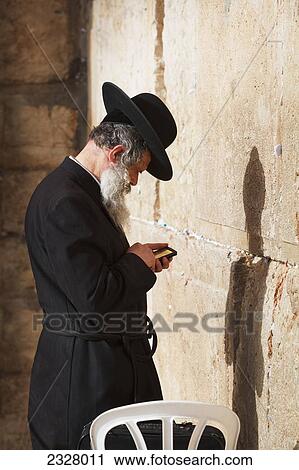 Israel, Side view of man praying at Wailing wall; Jerusalem View Large Photo Image Stock Image - Israel, Side view of man praying at Wailing wall; Jerusalem. Fotosearch