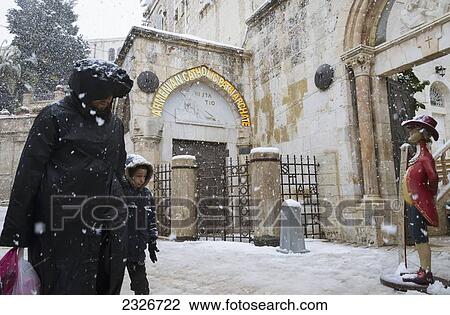 Israel, Third station of Via Dolorosa; Jerusalem, 2013, January 10, Man and boy walking on street View Large Photo Image Stock Image - Israel, Third station of Via Dolorosa; Jerusalem, 2013, January 10, Man and boy walking on street. Fotosearch