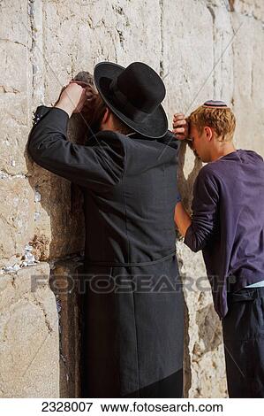 Israel, View of man praying at Wailing wall; Jerusalem View Large Photo Image Stock Photo - Israel, View of man praying at Wailing wall; Jerusalem. Fotosearch