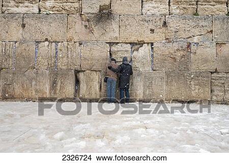 Israel, Western Wall; Jerusalem, 2013, January 10, Two pilgrims praying by wall View Large Photo Image Picture - Israel, Western Wall; Jerusalem, 2013, January 10, Two pilgrims praying by wall. Fotosearch