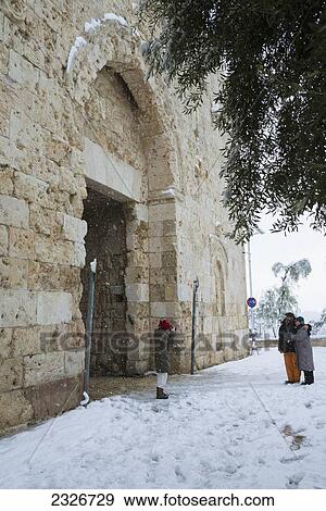 Israel, Zion gate; Jerusalem, 2013, January 10, Couple standing in front of gate View Large Photo Image Stock Photo - Israel, Zion gate; Jerusalem, 2013, January 10, Couple standing in front of gate. Fotosearch