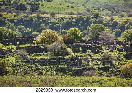 Stock Image - it used area as military stronghold. Only ruins are left behind of this military base; Israel, Syria controlled Golan Heights, Old ruins behind military base. From 1948-67. Fotosearch