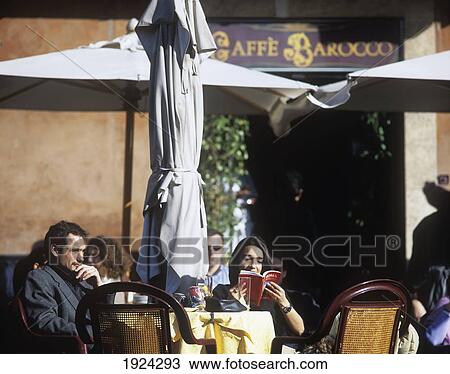 Italian Tourists At Cafe In Piazza Navona, Reading Guide Books View Large Photo Image Stock Image - Italian Tourists At Cafe In Piazza Navona, Reading Guide Books. Fotosearch