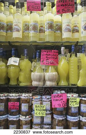 Stock Photo - Italy, Bottles Of Limoncello For Sale Shop; Naples. Fotosearch