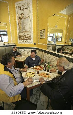 Italy, Customers Eating Pizza At Pizzeria Trianon Da Ciro; Naples View Large Photo Image Stock Image - Italy, Customers Eating Pizza At Pizzeria Trianon Da Ciro; Naples. Fotosearch