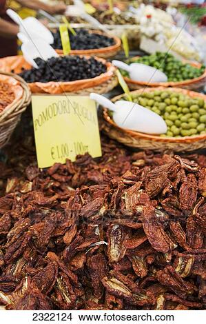 Italy, Emilia-Romagna, Ferrara, Close up of sun dried tomatoes and olives in a market View Large Photo Image Picture - Italy, Emilia-Romagna, Ferrara, Close up of sun dried tomatoes and olives in a market. Fotosearch