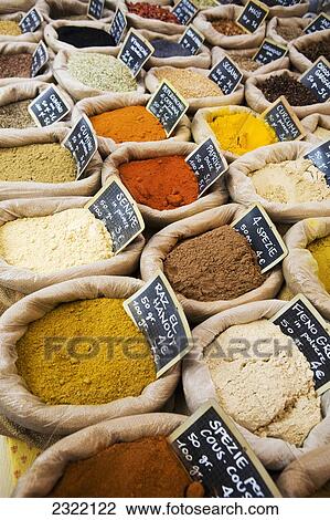 Stock Image - Italy, Emilia-Romagna, Ferrara, Close up of assorted spices in bags in market. Fotosearch