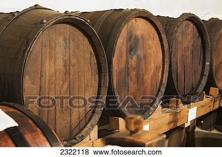 Stock Photo - Italy, Emilia-Romagna, Spilamberto, Close up of large oak barrels. Fotosearch