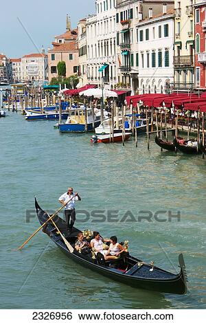 Italy, Gondelier punting tourists in gondola on Grand Cana; Venice View Large Photo Image Stock Photograph - Italy, Gondelier punting tourists in gondola on Grand Cana; Venice. Fotosearch