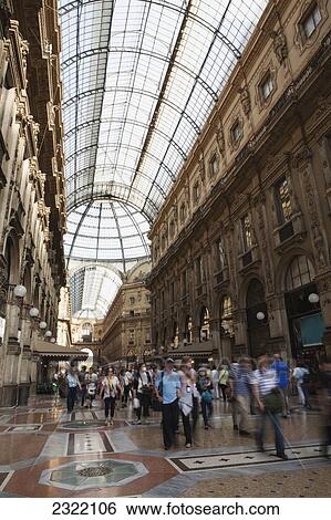Stock Photograph - Italy, Lombardia, Milano, Pedestrians in passage with domed glass ceiling. Fotosearch