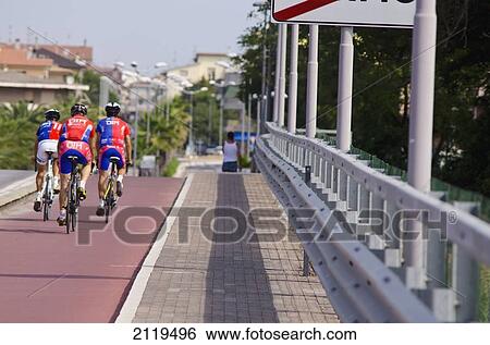 Italy, Marche, Group of cyclists on bicycle lane; Porto Sant' Elpidio View Large Photo Image Stock Photograph - Italy, Marche, Group of cyclists on bicycle lane; Porto Sant' Elpidio. Fotosearch