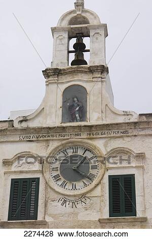 Stock Photo - Italy, Puglia, Vittorio Emanuele 11 Square (formerly Piazza dell'Orologio or Clock Square); Polignare del Mare, A small chapel in the heart of the old city. Fotosearch