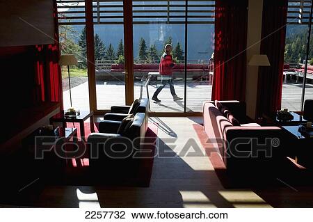 Stock Image - Italy, South Tyrol, Man Walking Outside Of Vigilius Mountain Resort; Lana. Fotosearch