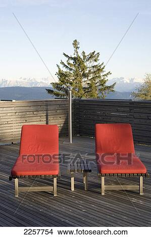 Italy, South Tyrol, Sun Loungers With Mountains In Background At Vigilius Mountain Resort; Lana View Large Photo Image Picture - Italy, South Tyrol, Sun Loungers With Mountains In Background At Vigilius Mountain Resort; Lana. Fotosearch
