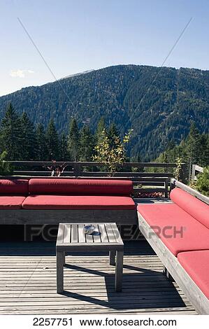 Stock Image - Italy, South Tyrol, Sun Loungers With Mountains In Background At Vigilius Mountain Resort; Lana. Fotosearch