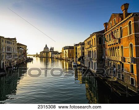 Italy, Venice, Buildings along canal at sunset View Large Photo Image Stock Photo - Italy, Venice, Buildings along canal at sunset. Fotosearch