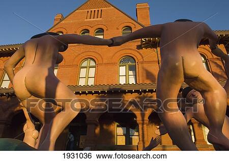 Stock Photograph - J. Seward Johnson's Sculpture Daydream; J. Seward Johnson's Sculpture Daydream, Inspired By Henri Matisse's The Dance On Display At Key West Custom House Museum. Florida Keys.. Fotosearch