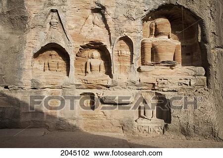 Stock Image - Jain Sculptures Carved In To The Cliff On The Southern Approach To The Fort, Gwalior, Madhya Pradesh, India. Fotosearch