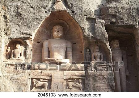 Stock Image - Jain Sculptures Carved In To The Cliff On The Southern Approach To The Fort, Gwalior, Madhya Pradesh, India. Fotosearch