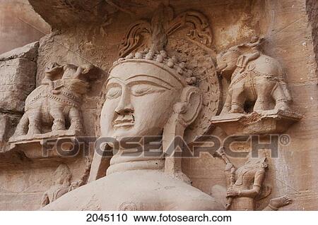 Stock Image - Jain Sculptures Carved In To The Cliff On The Southern Approach To The Fort, Gwalior, Madhya Pradesh, India. Fotosearch