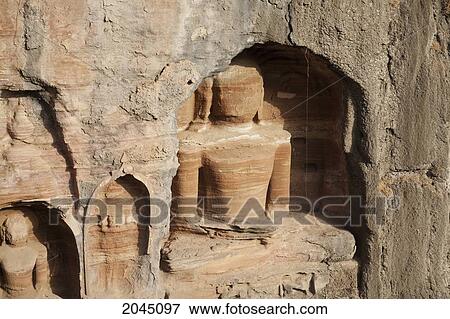 Stock Photo - Jain Sculptures Carved In To The Cliff On The Southern Approach To The Fort, Gwalior, Madhya Pradesh, India. Fotosearch
