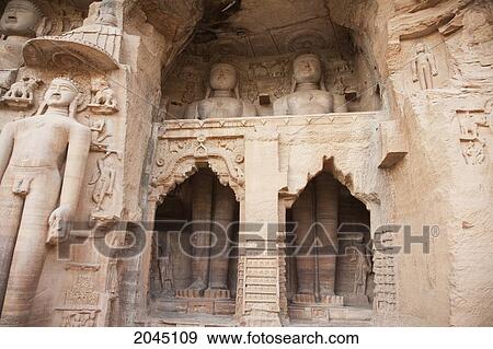 Stock Photo - Jain Sculptures Carved In To The Cliff On The Southern Approach To The Fort, Gwalior, Madhya Pradesh, India. Fotosearch
