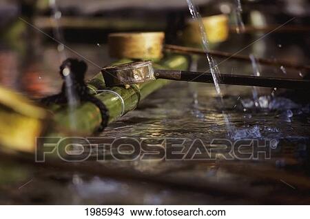 Stock Image - Japan, Kyoto, Heian Shrine, Close-Up Of Water Dippers In Fountain.. Fotosearch