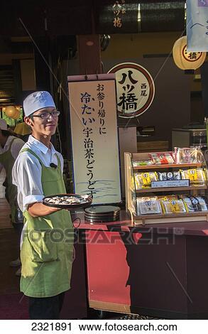 Japan, Kyoto, Server holding tray and smiling at Teapot Lane View Large Photo Image Stock Image - Japan, Kyoto, Server holding tray and smiling at Teapot Lane. Fotosearch