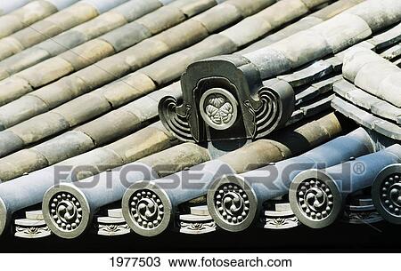 Stock Image - Japan, Tokyo, Imperial Palace, Higashi-Gyoen, East Gardens, Japanese Roof Tiles And Design.. Fotosearch