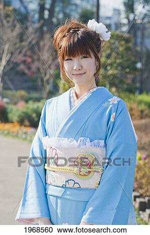Stock Image - Japan, Tokyo, Pretty Japanese Woman In A Blue Kimono.. Fotosearch