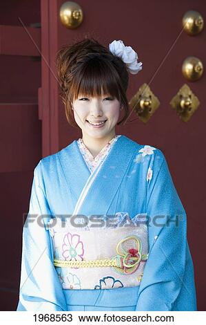 Stock Image - Japan, Tokyo, Pretty Japanese Woman In A Blue Kimono.. Fotosearch