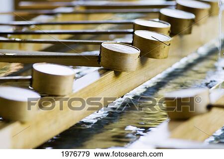 Stock Photo - Japan, Water Fountain And Ladles; Tokyo, Meiji Jingu Shrine. Fotosearch