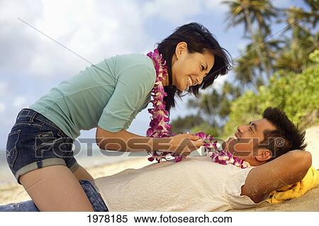 Japanese Couple On The Beach Wearing Leis. View Large Photo Image Stock Photography - Japanese Couple On The Beach Wearing Leis.. Fotosearch