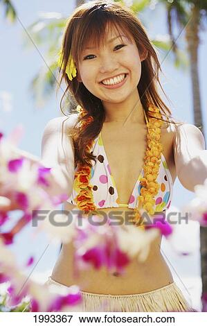 Japanese Girl In Hula Skirt Holding Out A Lei View Large Photo Image Stock Photo - Japanese Girl In Hula Skirt Holding Out A Lei. Fotosearch