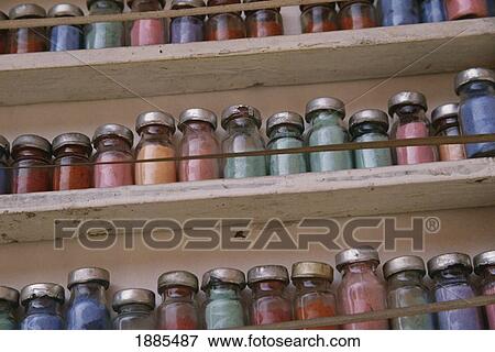 Stock Photo - Jars Of Colored Dyes In Bottles On Shelves. Fotosearch