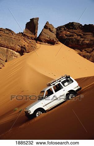 Jeep Crossing Sand Dunes, Tadrart-Acacus View Large Photo Image Stock Image - Jeep Crossing Sand Dunes, Tadrart-Acacus. Fotosearch