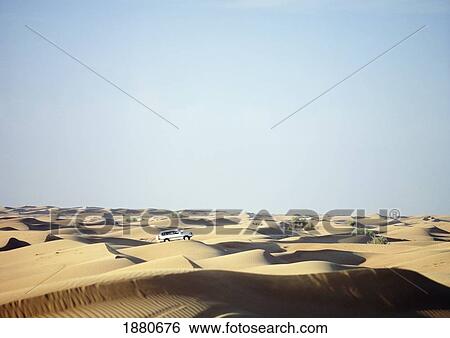 Jeep Driving Across Dunes At Dusk Near Dubai View Large Photo Image Stock Photograph - Jeep Driving Across Dunes At Dusk Near Dubai. Fotosearch