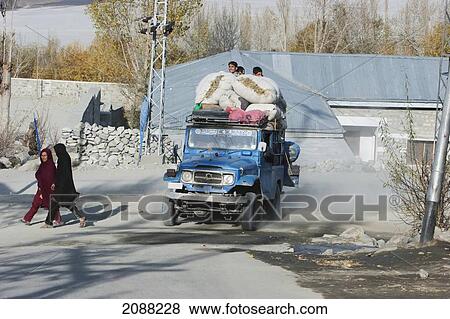 Stock Photo - Jeep Laden With Sacks Full Of Leaves, Khaplu, Northern Areas, Pakistan. Fotosearch