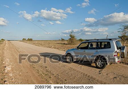 Stock Photograph - Jeep On Kilimanjaro Road At Amboseli, Kenya. Fotosearch