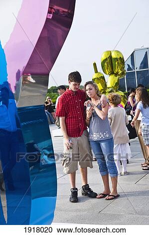Stock Image - Jeff Koons Sculpture On Roof Of Moma. Fotosearch