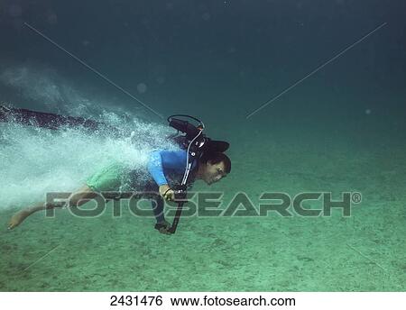 Stock Photograph - Jet pack underwater; Grand Cayman, Cayman Islands. Fotosearch