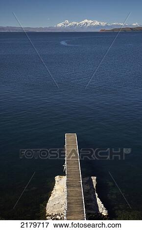 Stock Photo - Jetty with Illampu peak in the distance, the Island of The Sun, Lake Titicaca; Bolivia. Fotosearch