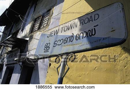 Stock Photography - Jew Town Road Sign Outside Buildings In Cochin. Fotosearch