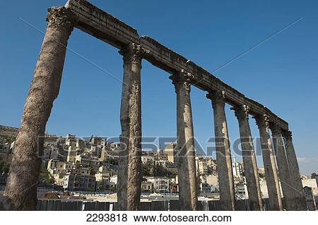 Stock Photo - Jordan, and oriented north to keep the sun off the spectators; Amman, 000 people. It is built into hillside, large and steeply raked theatre could seat about 6, Ancient columns along walkway outside Roman Theatre. Built during reign of Marcus Aurelius. Fotosearch