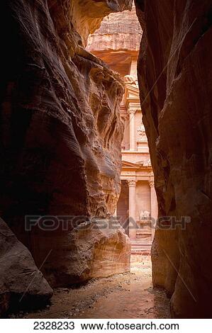 Stock Image - Jordan, El Khazneh seen from natural narrow canyon; Petra. Fotosearch