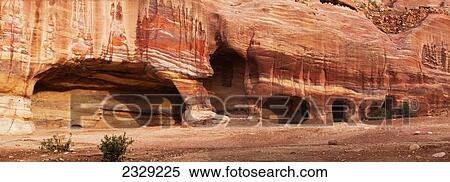 Stock Photography - Jordan, Facade of ancient rock buildings; Petra. Fotosearch