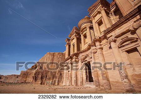Jordan, it measures 50 metres wide by approximately 45 metres high; Petra, Ad Deir (Arabic for The Monastery) is monumental building carved out of rock in ancient city of Petra. Built by Nabataeans in 1st century View Large Photo Image Stock Image - Jordan, it measures 50 metres wide by approximately 45 metres high; Petra, Ad Deir (Arabic for The Monastery) is monumental building carved out of rock in ancient city of Petra. Built by Nabataeans in 1st century. Fotosearch