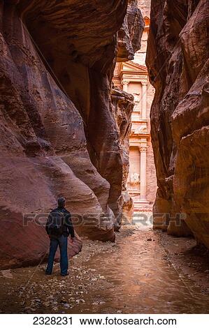 Jordan, Man looking at El Khazneh seen from natural narrow canyon; Petra View Large Photo Image Stock Image - Jordan, Man looking at El Khazneh seen from natural narrow canyon; Petra. Fotosearch