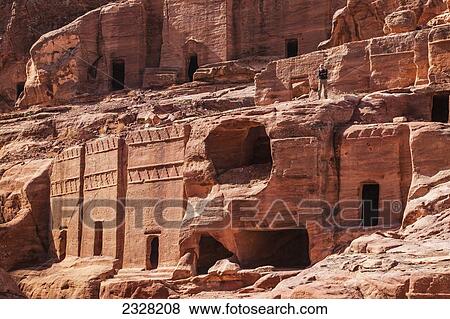 Jordan, Tourist viewing ancient buildings; Petra View Large Photo Image Stock Photo - Jordan, Tourist viewing ancient buildings; Petra. Fotosearch