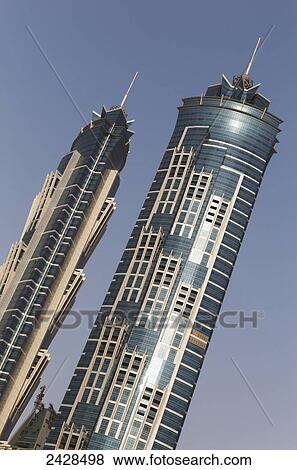 Stock Photo - JW Marriott Marquis Dubai Hotel against a blue sky; Dubai, United Arab Emirates. Fotosearch